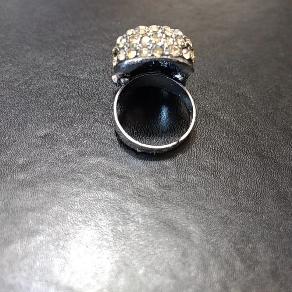 Silver tone and rhinestone skull ring adjustable